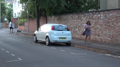 Unknown girl walks and strips on the street