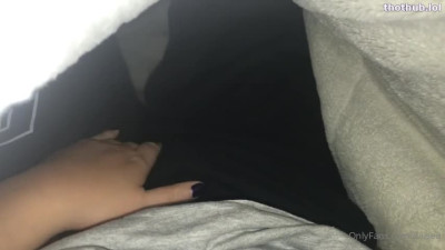 Daisea caresses herself in sleep pants under the blanket